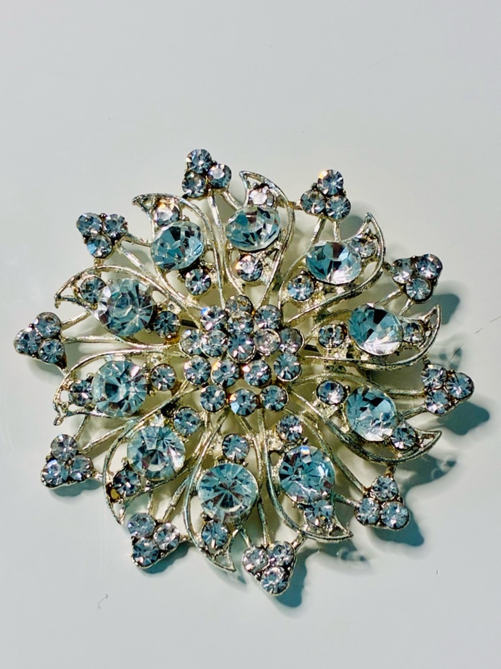 Crystal Floral Burst Brooch - Light Blue Rhinestone Accent